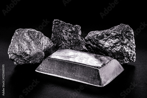 platinum ingot and nugget, noble metal, used in the production of catalysts, luxury jewelry, isolated black background photo