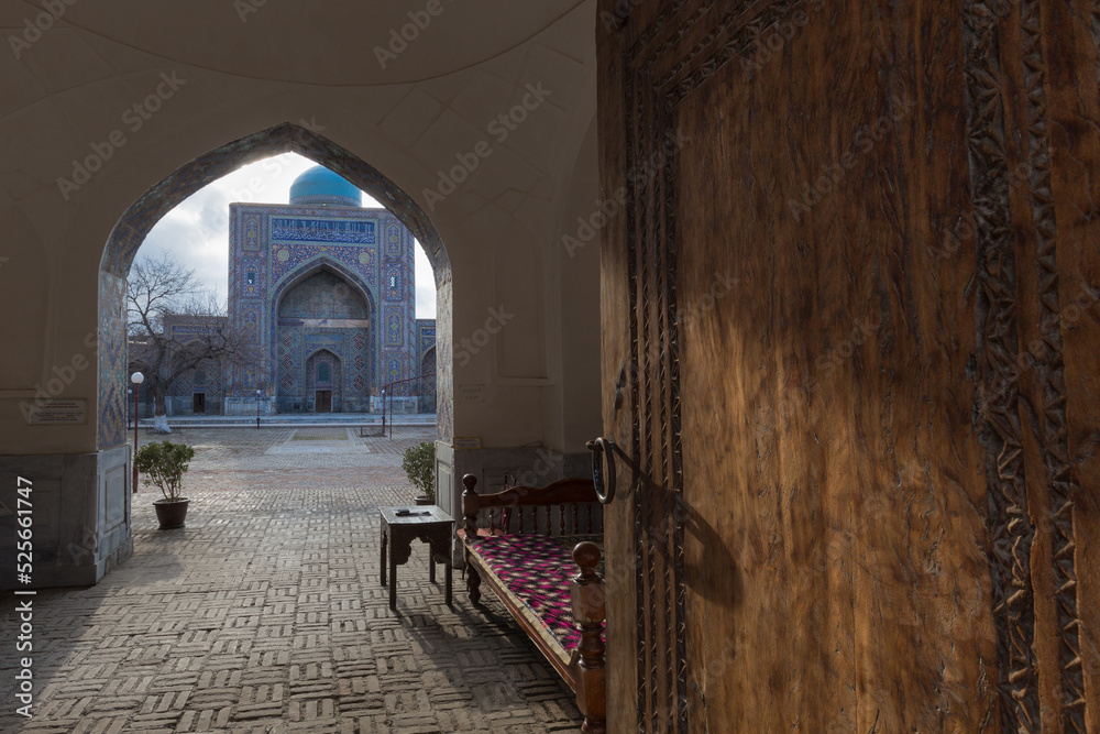 Entrance to ancient traditional Uzbek madrasah courtyard, Samarkand, Uzbekistan