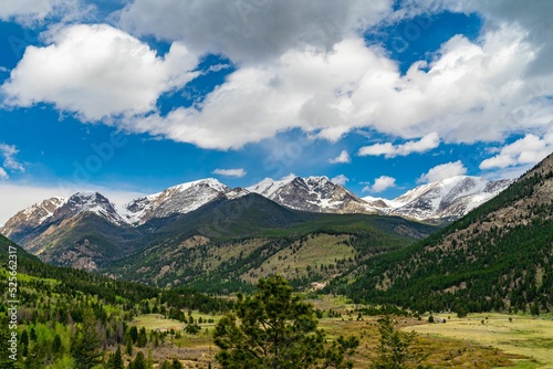Shot of Rocky mountains in the national park with forests and sky in the background photo