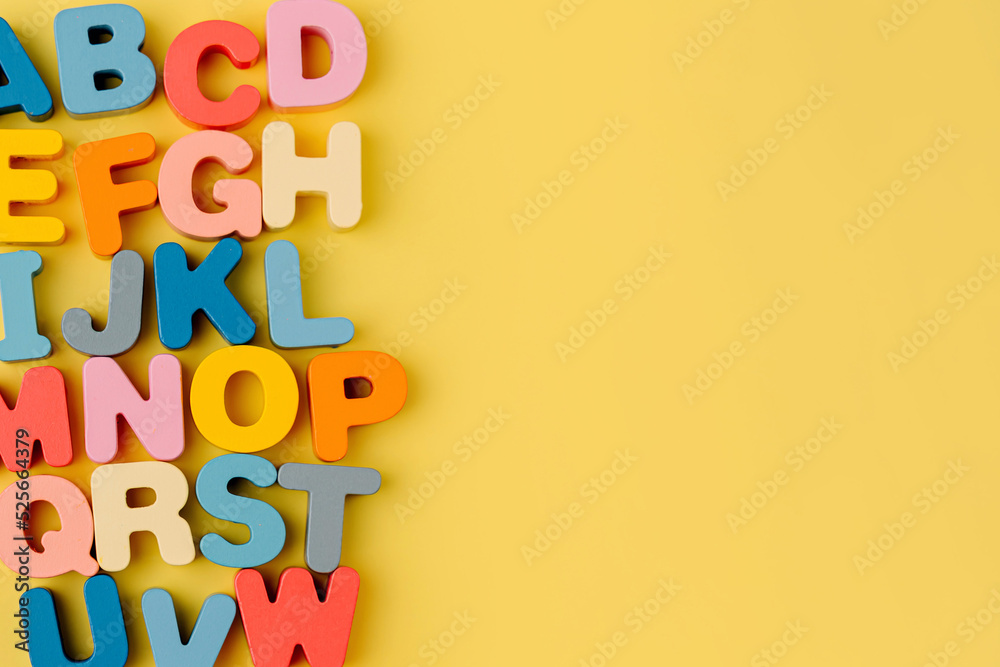 Colorful letters of the alphabet on yellow background. Primary school
