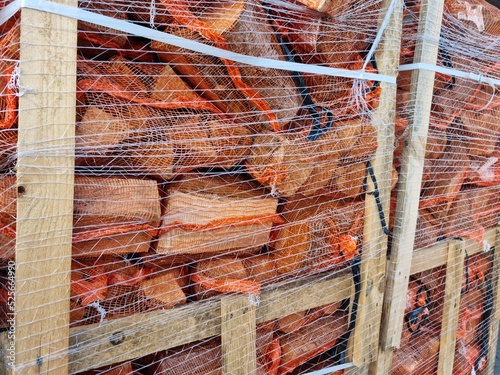 Wiązki drewna opałowego przygotowane do transportu.  photo