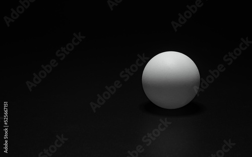 ping pong ball on black background