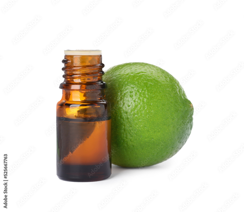 Bottle of citrus essential oil and fresh lime isolated on white Bottle of citrus essential oil and fresh lime isolated on white
