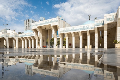 King Abdullah I Mosque in Amman, Jordan, with reflections in puddle water photo