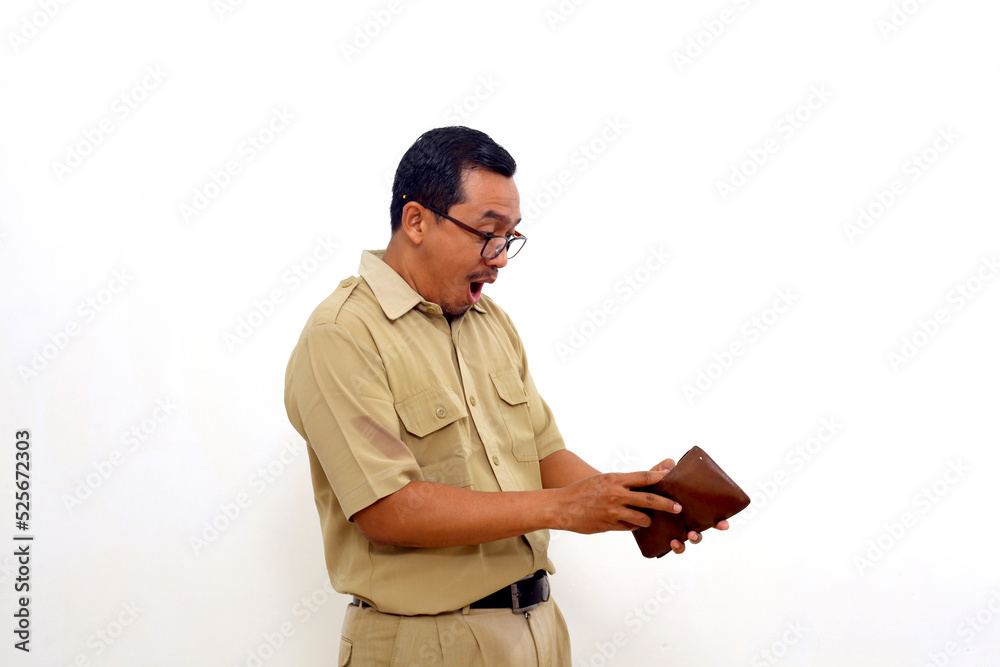 Surprised Indonesian government employees standing while checking his wallet. Isolated on white Surprised Indonesian government employees standing while checking his wallet. Isolated on white