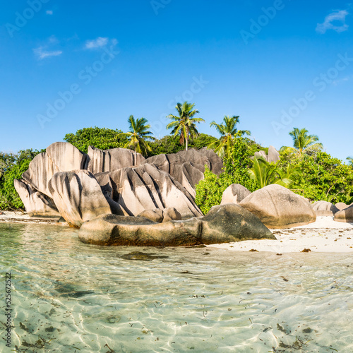 Rock formation with palm trees at Anse Source d'Argent beach, La Digue island, Seychelles