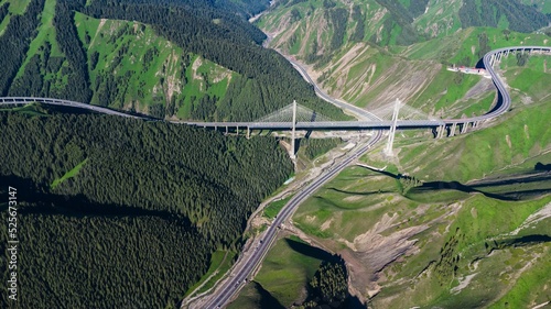 Bird's eye view of the Guozigou Bridge in green mountains in China photo