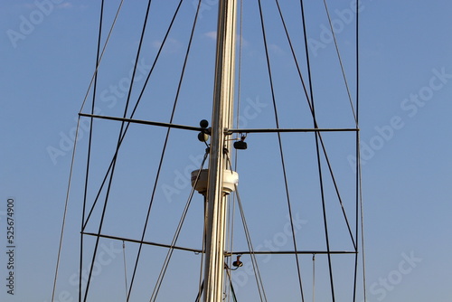 фотографія Ship masts against the blue sky.