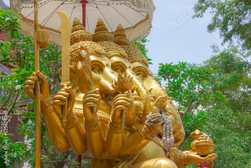 golden ganesha statue It is revered by those who see it in religion, is an Asian-style sculpture. photo