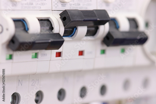 Automatic current switches for protection of electrical loads installed in the electrical panel. Soft focus.