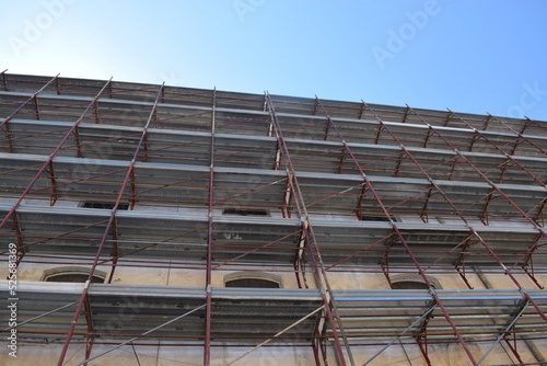 High-rise building in partinico, with construction scaffolding photo