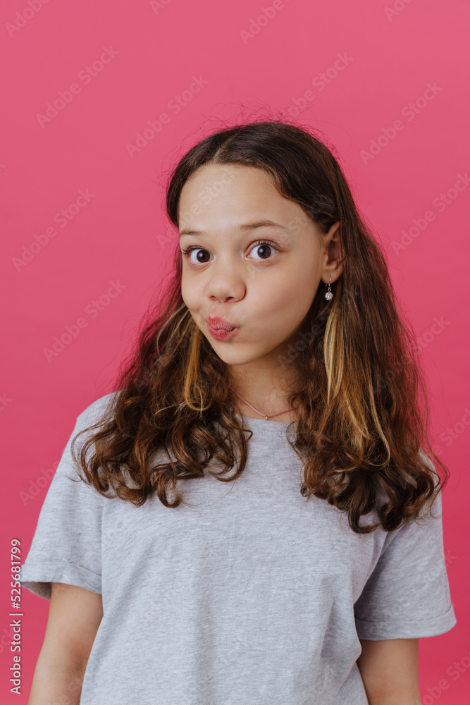 White confused girl wearing t-shirt grimacing and looking at camera White confused girl wearing t-shirt grimacing and looking at camera