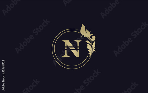 Golden leaf circle and creative logo design vector with the letters for professional brand and business N