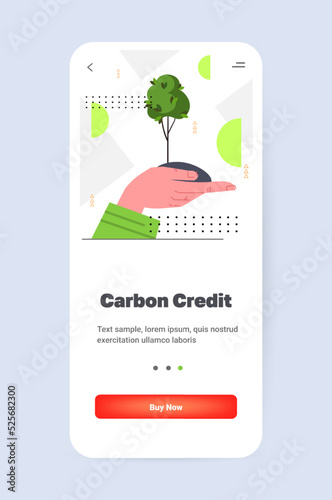 hand holding green tree CO2 limit emissions idea net zero emission carbon credit offset eco factory environmental conservation