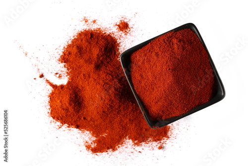 Print op canvas Pile of red paprika  in porcelain  isolated on white, top view