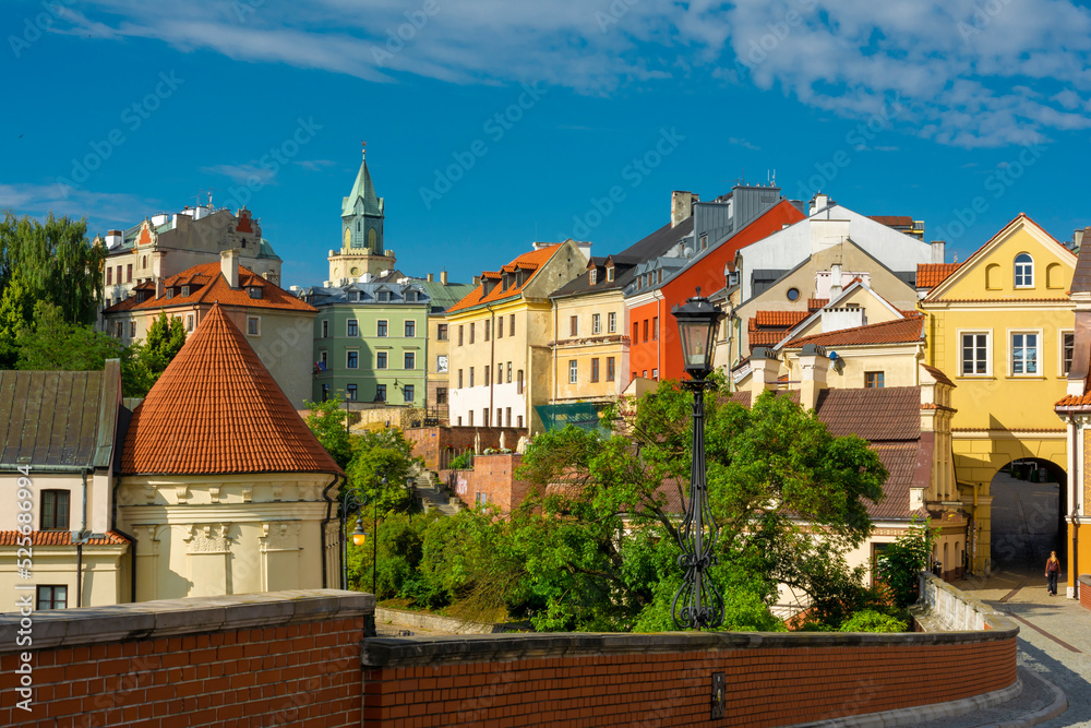 Lublin, Lubelskie Voivodeship / Poland - July 10 2022: tenement houses in Lublin old town illuminated by the morning sun.