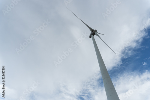 wind turbine on a background of grey clouds