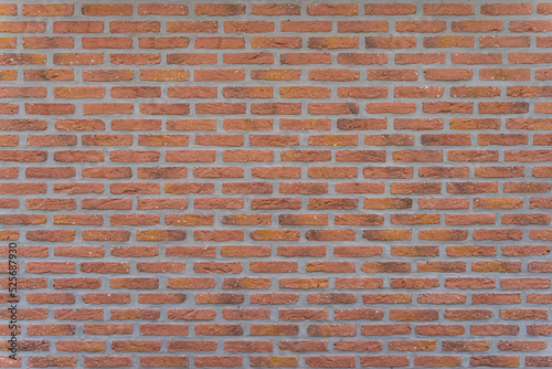 Red brick wall with modern mortar joints