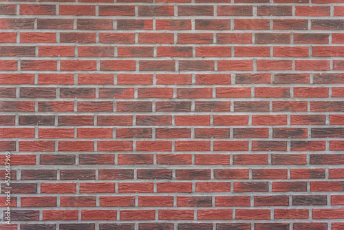Red brick wall with modern mortar joints