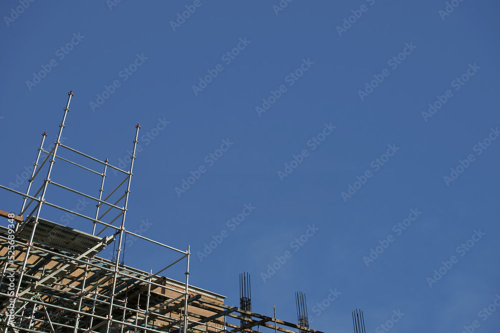 Aluminum Scaffolding & Ladder at a Construction Site with Blue Sky Background
