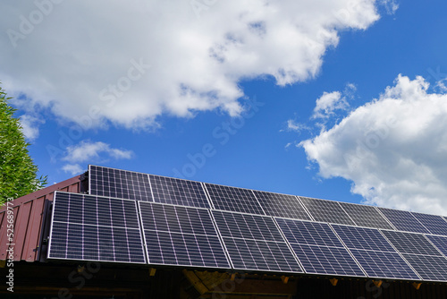 Wallpaper Mural Many photovoltaic solar panels mounted on wooden house roof, roof of solar cells Torontodigital.ca
