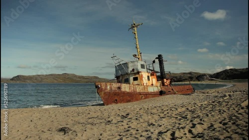 Lonely ship washed ashore in the Arctic after a storm