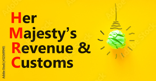 HMRC her majestys revenue and customs symbol. Concept words HMRC her majestys revenue and customs on beautiful yellow background. Business HMRC revenue and customs concept. Copy space. photo