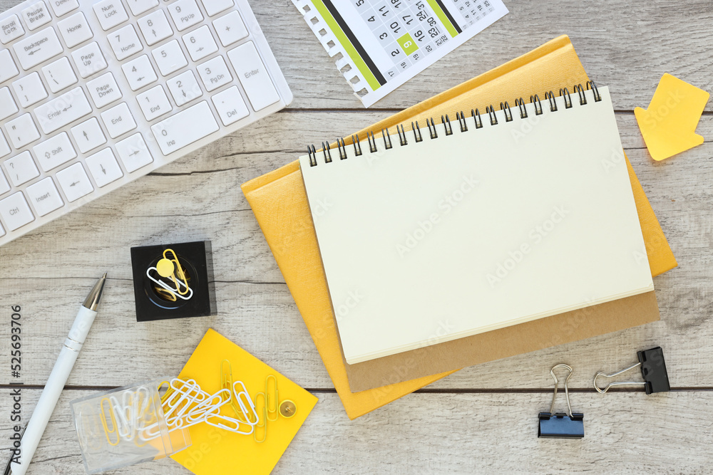 open notepad, white pen on gray background, spiral notepad on the table Business, planning, education. Top view flat layout open notepad, white pen on gray background, spiral notepad on the table Business, planning, education. Top view flat layout