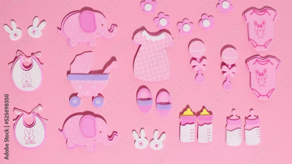 Funny pink stickers, symbolizing a newborn girl, appear on a pink background. Stop motion animation cartoon Funny pink stickers, symbolizing a newborn girl, appear on a pink background. Stop motion animation cartoon