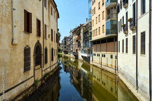 Residential buildings with balconies on the canal in the city of Padua