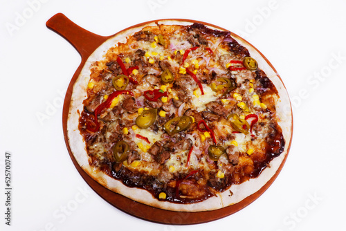beef flatbread pizza with BBQ sauce, corn, peppers and herbs