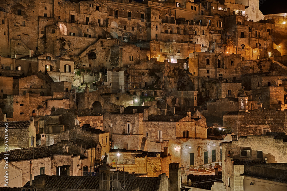 Matera, Basilicata, Italy: night view of the picturesque old town called Sasso Barisano, in the city European Capital of Culture 2019