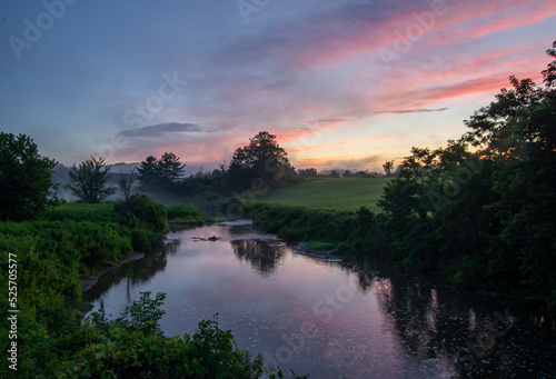 Vermont summer sunset over a quiet creek © Cody