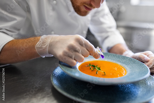 Obraz na płótnie food cooking, profession and people concept - close up of male chef with flower