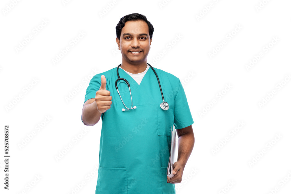 healthcare, profession and medicine concept - happy smiling indian doctor or male nurse in blue uniform with stethoscope showing thumbs up over white background healthcare, profession and medicine concept - happy smiling indian doctor or male nurse in blue uniform with stethoscope showing thumbs up over white background