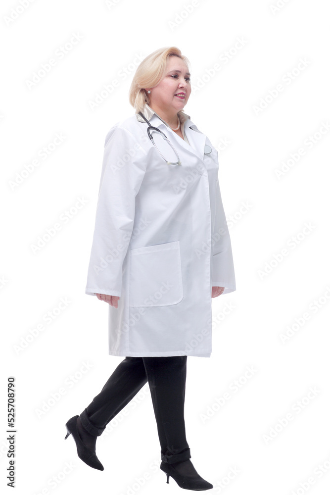 Female doctor walking towards the camera smiling Female doctor walking towards the camera smiling