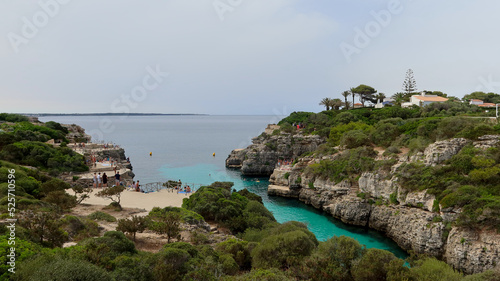 Cala en Brut beach, Menorca (Minorca), Spain. Lovely bay and beach Cala'n Brut. Popular place to jump into water from rock shelves 