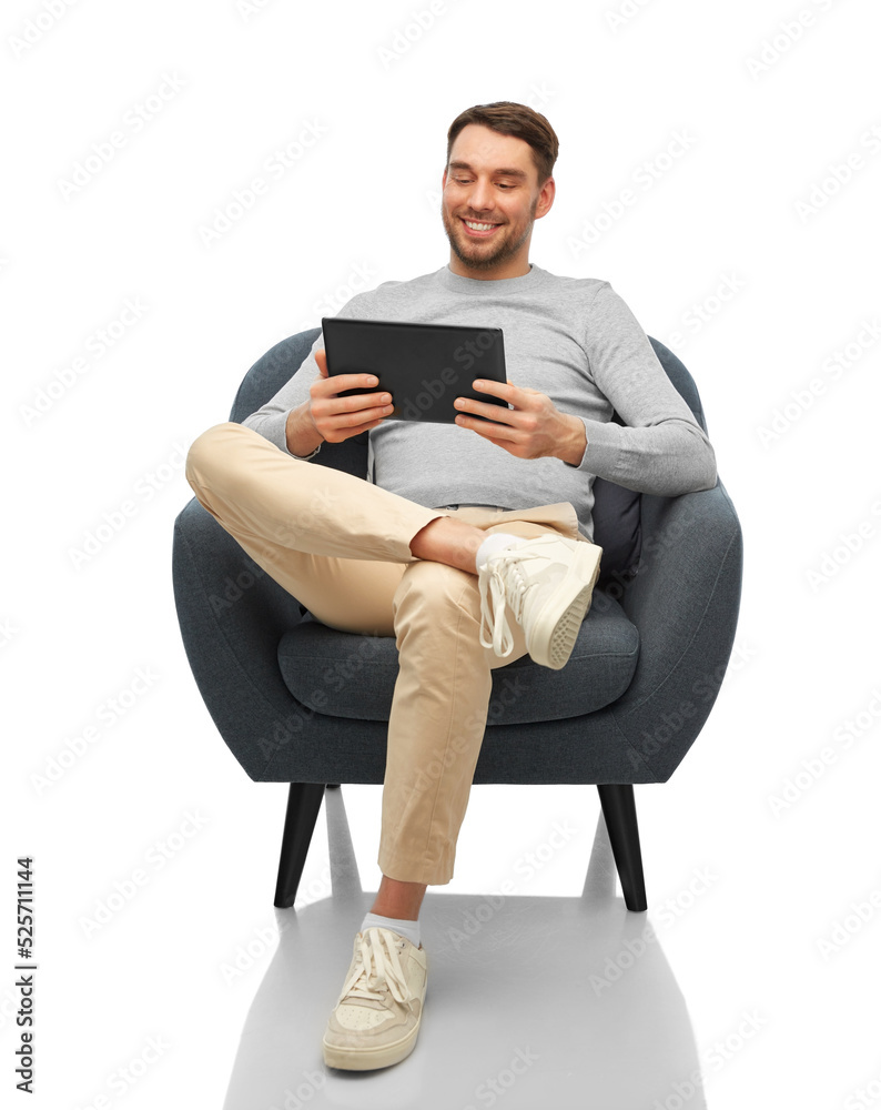 people, technology and furniture concept - happy smiling man with tablet pc computer sitting in chair over white background people, technology and furniture concept - happy smiling man with tablet pc computer sitting in chair over white background