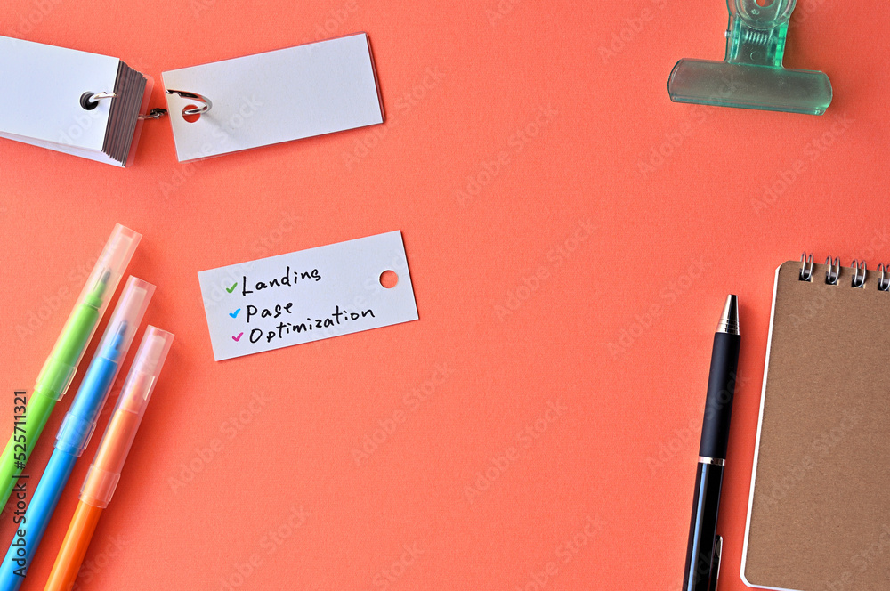 There is word card with the word Landing Page Optimization on the desk. There is word card with the word Landing Page Optimization on the desk.