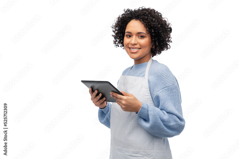 cooking, culinary and people concept - happy smiling woman in apron with tablet pc computer over white background