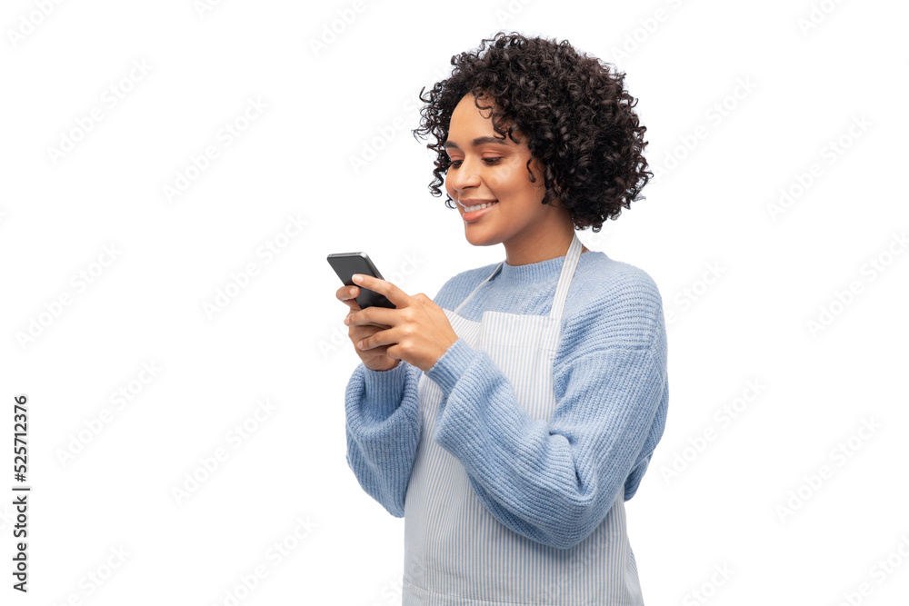 cooking, culinary and people concept - happy smiling woman in apron with smartphone over white background cooking, culinary and people concept - happy smiling woman in apron with smartphone over white background