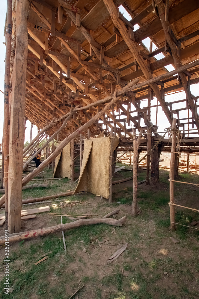 man making wooden roof, mason making roof formwork, with cap and hammer, mexico man making wooden roof, mason making roof formwork, with cap and hammer, mexico