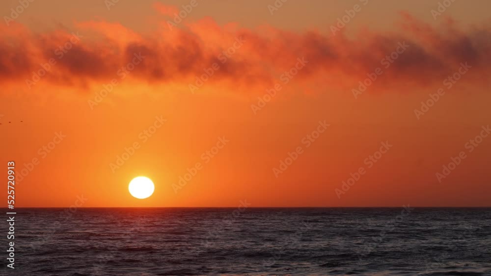 Sun setting over the Pacific Ocean. Shot near Monterey on central coast of California Sun setting over the Pacific Ocean. Shot near Monterey on central coast of California