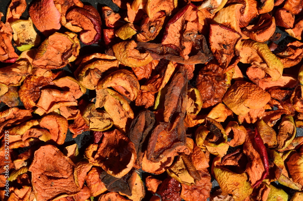 Fragrant apple drying lies on a metal tray. Fragrant apple drying lies on a metal tray.
