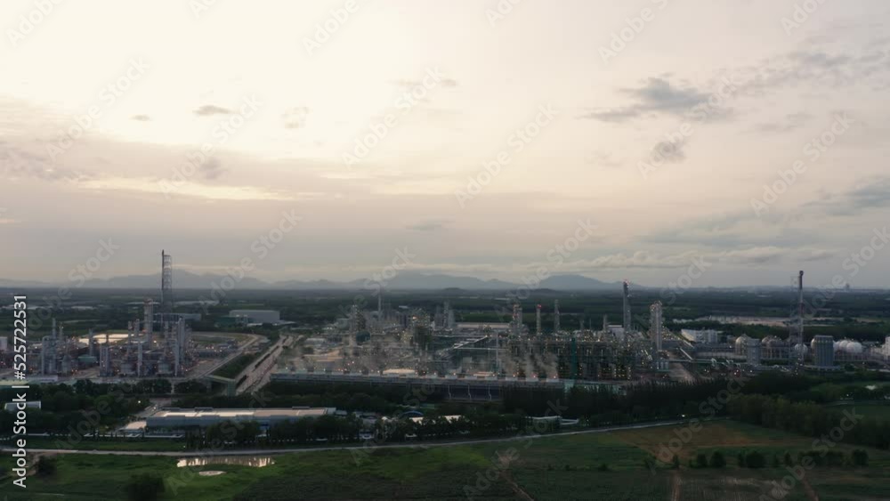 Aerial view drone flying with light oil terminal is industrial facility for storage of oil and petrochemical. oil manufacturing products. power electric plant. low light. Refinery b roll drone shot 4k Aerial view drone flying with light oil terminal is industrial facility for storage of oil and petrochemical. oil manufacturing products. power electric plant. low light. Refinery b roll drone shot 4k