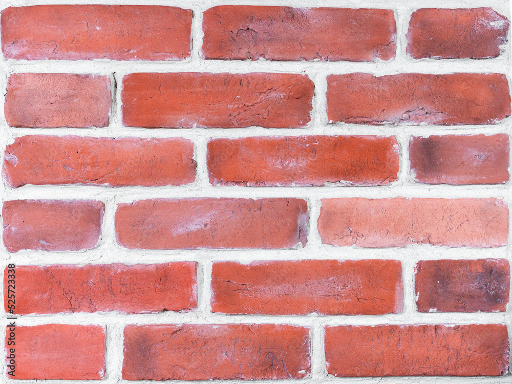 Obraz premium Wall is made of red decorative brick facade decoration. Plaster blocks based on casts of old bricks. Restoration of old buildings and facades. Hobby, craft