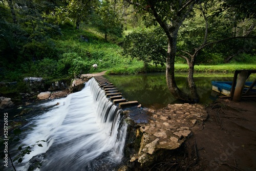 Small dam with water flowing downstream in San Cristobal, Chiapas, Mexico photo