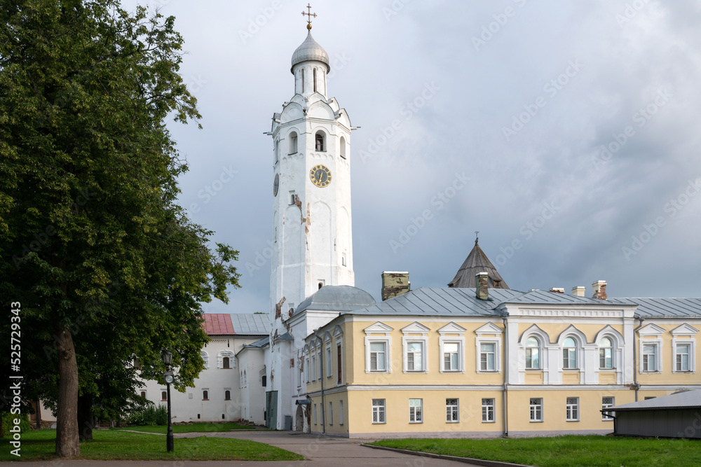View of the Ioanovsky Building (19th c.) and The Clock Tower (17th c.) on the territory of the Novgorod Kremlin on a summer day, Veliky Novgorod, Russia View of the Ioanovsky Building (19th c.) and The Clock Tower (17th c.) on the territory of the Novgorod Kremlin on a summer day, Veliky Novgorod, Russia
