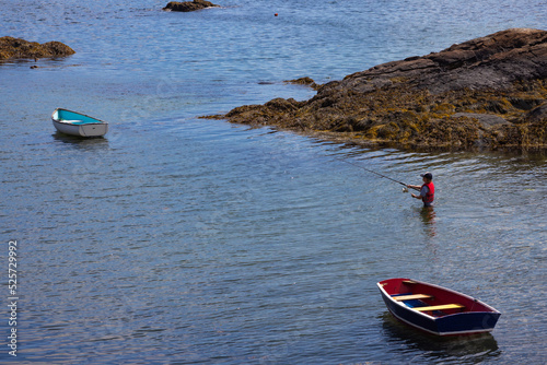 Fisherman Fishing Inside Atlantic Ocean Shore Landscape