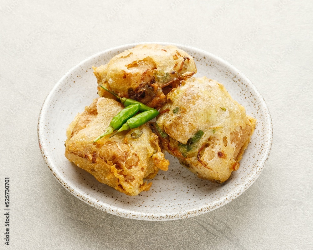 Deep fried stuffed tofu chopped mixed vegetables or called Tahu Isi, Indonesian traditional popular snack. Close up Deep fried stuffed tofu chopped mixed vegetables or called Tahu Isi, Indonesian traditional popular snack. Close up